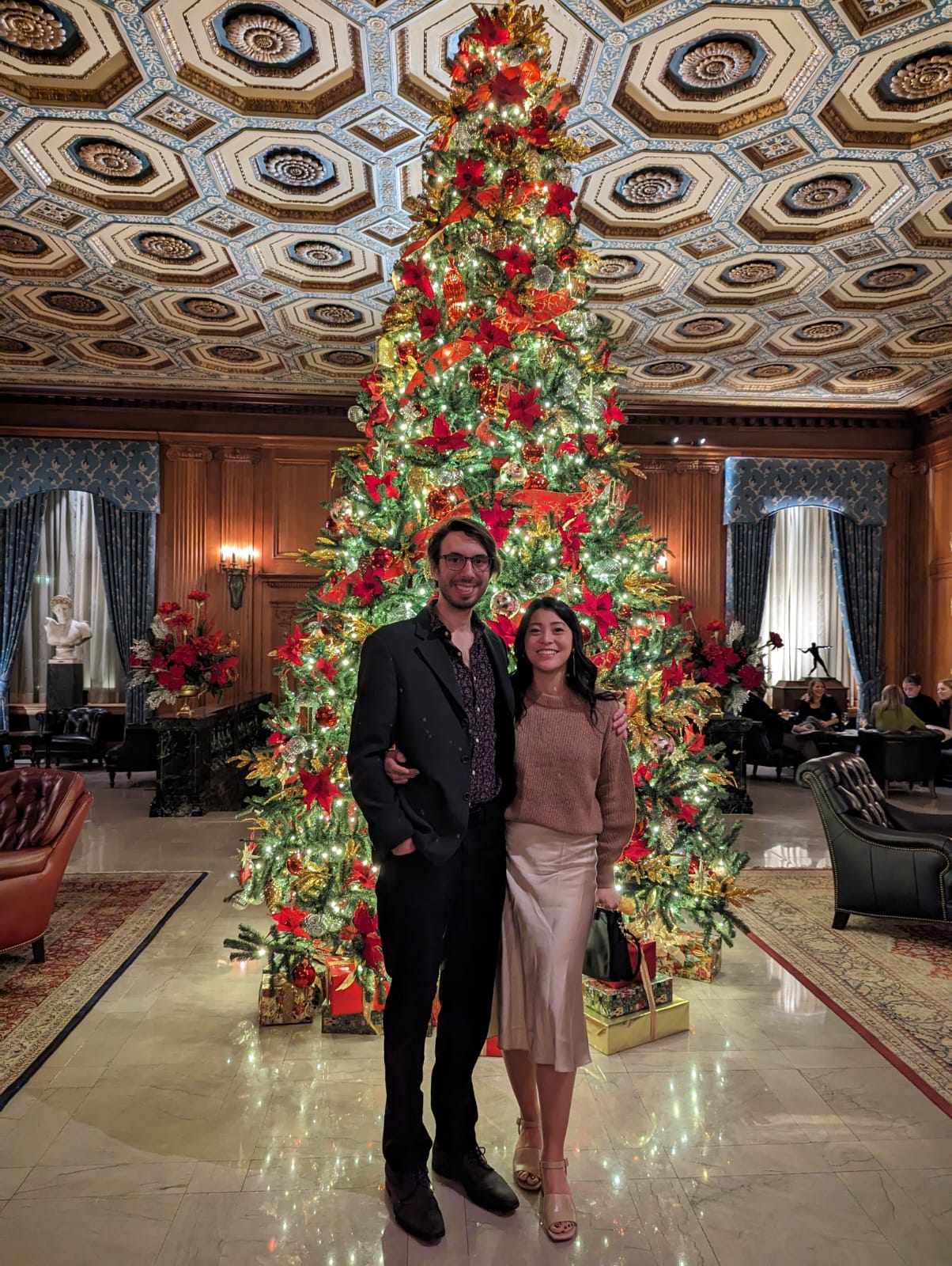 Holiday photo by the Christmas tree